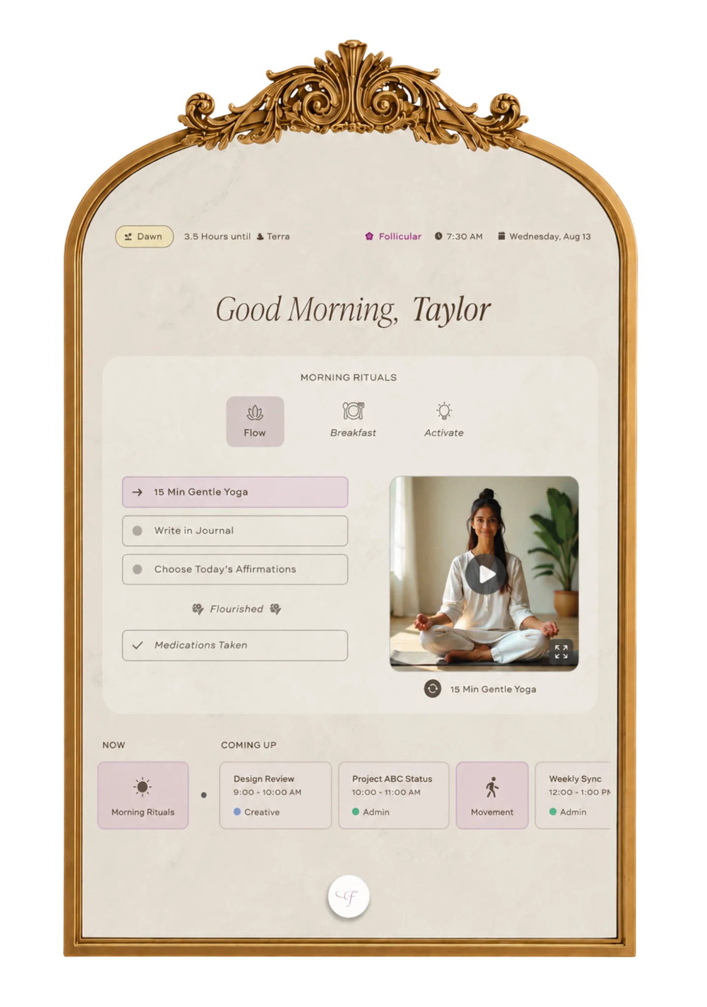 "Fleurair," a smart mirror with an ornate gold frame, displays a calming morning ritual dashboard with soft botanical imagery, gentle wellness prompts, and elegant serif typography in warm neutral tones.